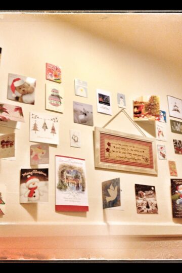 A wall showcasing an abundance of Christmas cards.