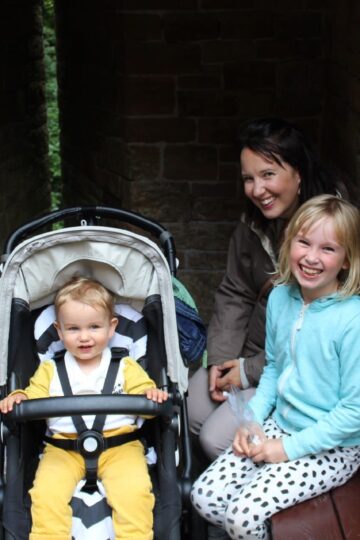 A family posing in a tunnel with their baby in a stroller in August 2015.