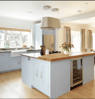 Renovating a house with a blue island in the kitchen.