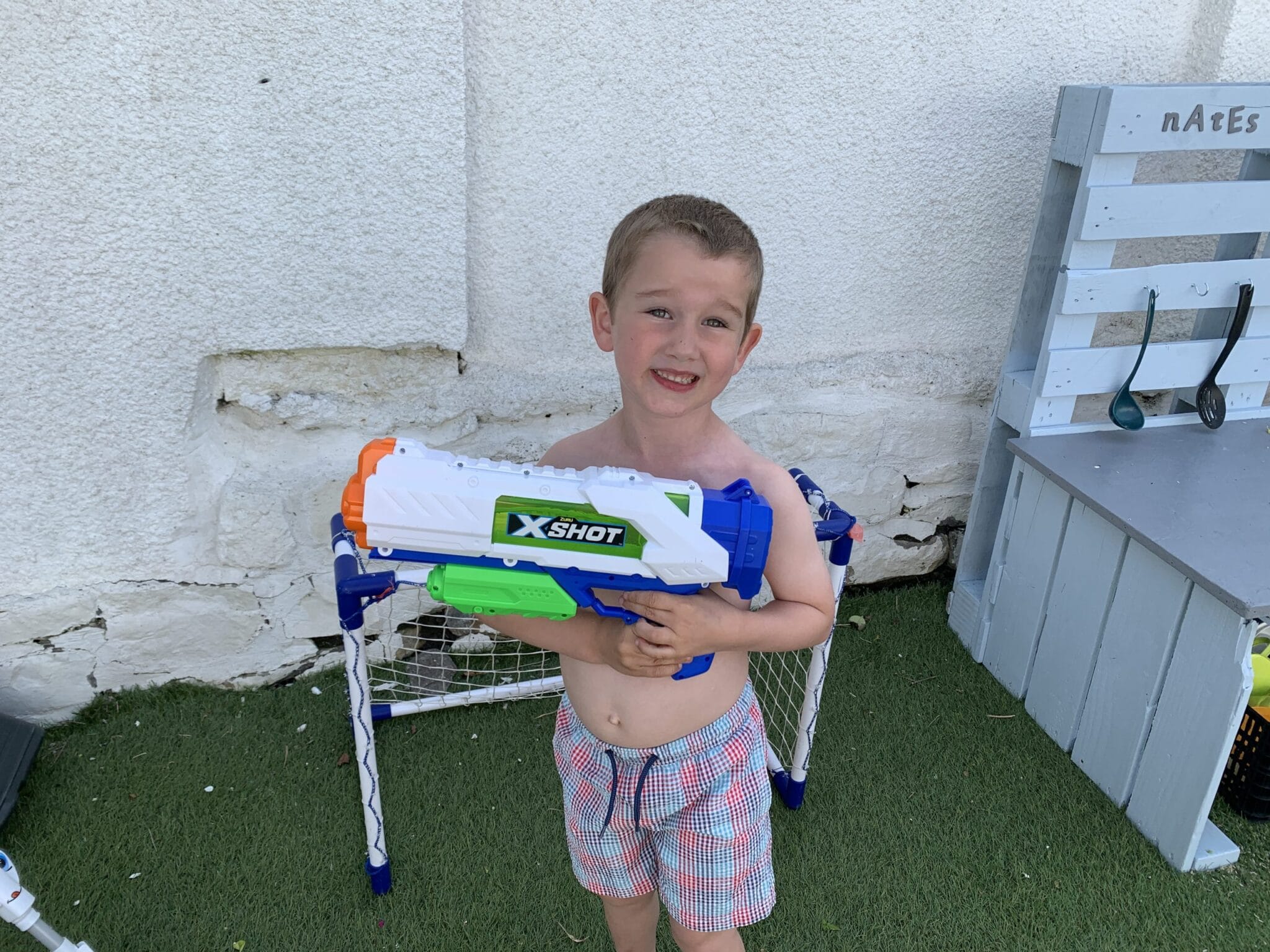 little boy with a water gun