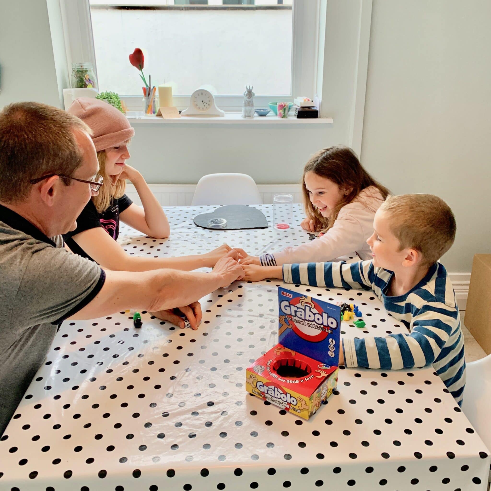 family playing grabolo game