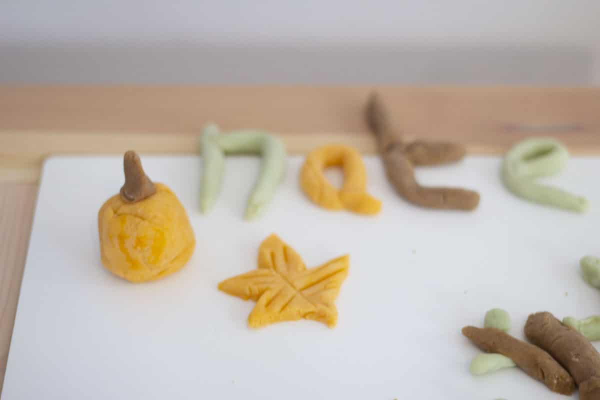 letters, leaves and a pumpkin made from homemade playdough
