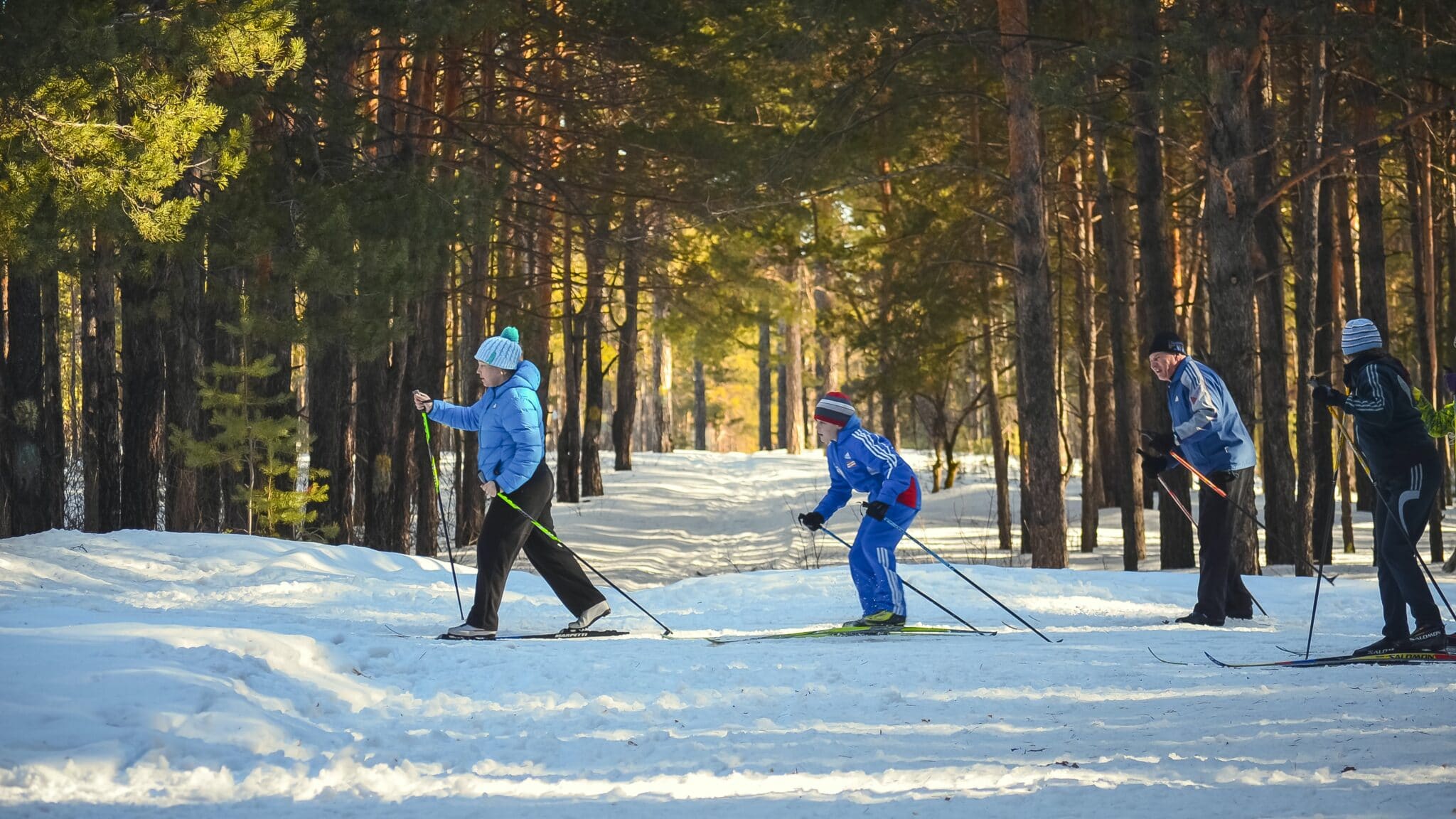 an adult and a child skiing.