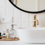 Elegant bathroom space with gold faucet and modern accessories updated for 2023.