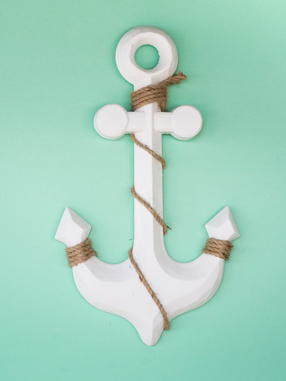 white wooden anchor with rope