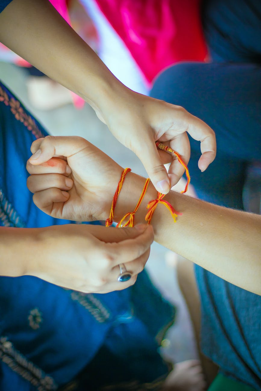 a person wearing a friendship string bracelet