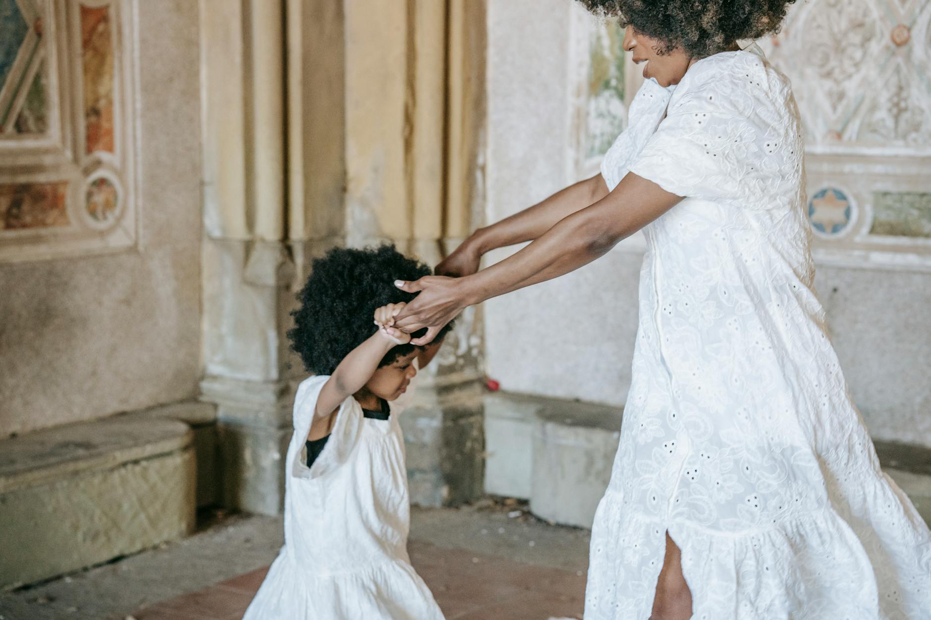 a woman dancing with her daughter