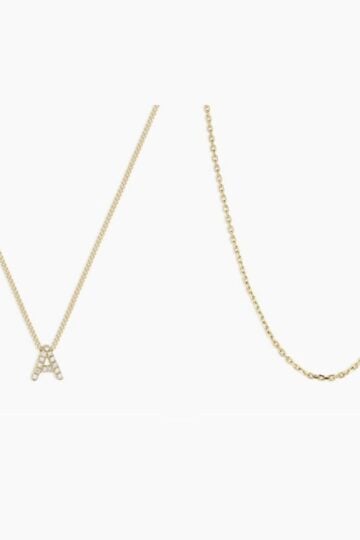 Two gold necklaces side by side embody Everyday Elegance—one features a sparkling "A" pendant, while the other is a simple gold chain, showcasing Timeless Style for any occasion.