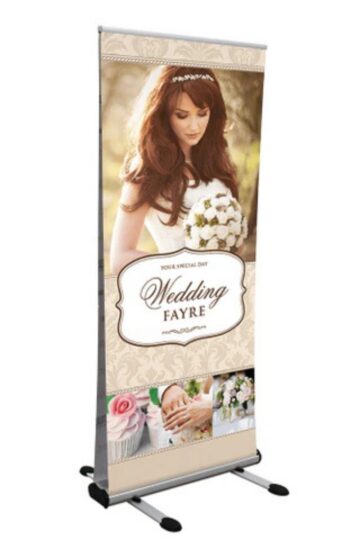 A standing roller banner for a wedding fayre featuring a bride holding a bouquet, with text reading “Your Special Day Wedding Fayre” and images of wedding-themed items—perfect for your exhibition essentials.