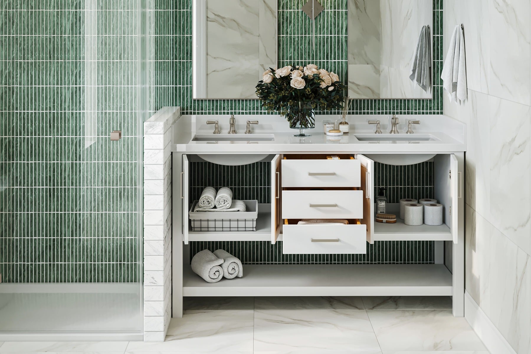 How to Choose a Bathroom Vanity That Actually Survives Family Life A modern bathroom vanity with drawers and cupboard doors open, displaying neatly organised towels, toiletries, and a vase of flowers on the worktop.