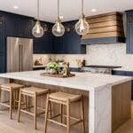 Modern Kitchen Cabinets Ideas: Stylish and Functional Solutions for Your Home Modern kitchen with navy cupboards, marble island with wooden stools, stainless steel appliances, pendant lights, and neutral splashback.