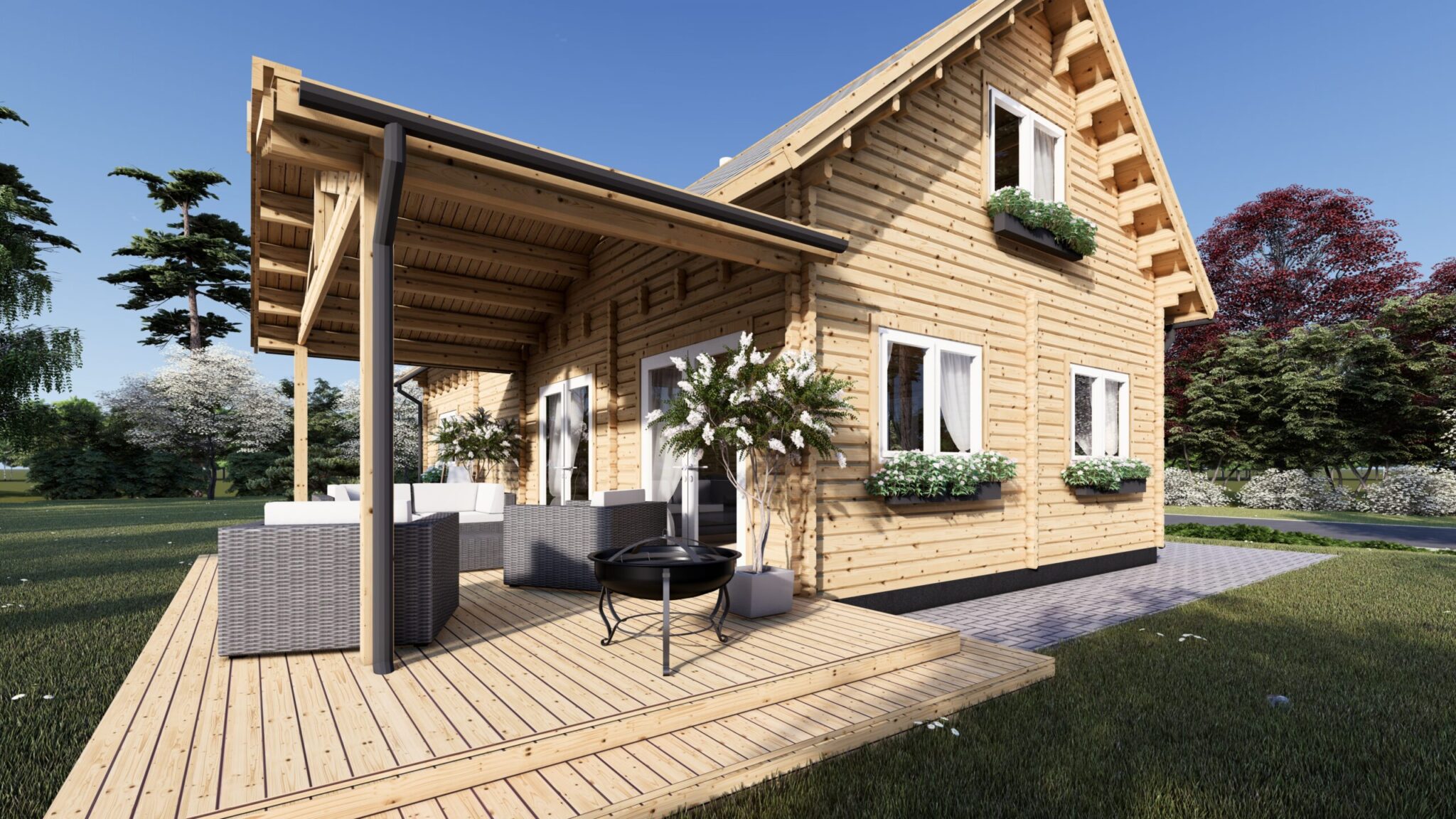 A wooden house with a covered veranda, outdoor seating area, and window boxes on the windows, surrounded by grass and trees under a clear sky.