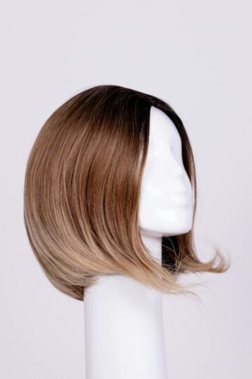 A short brown ombré wig displayed on a white mannequin head against a plain light background.